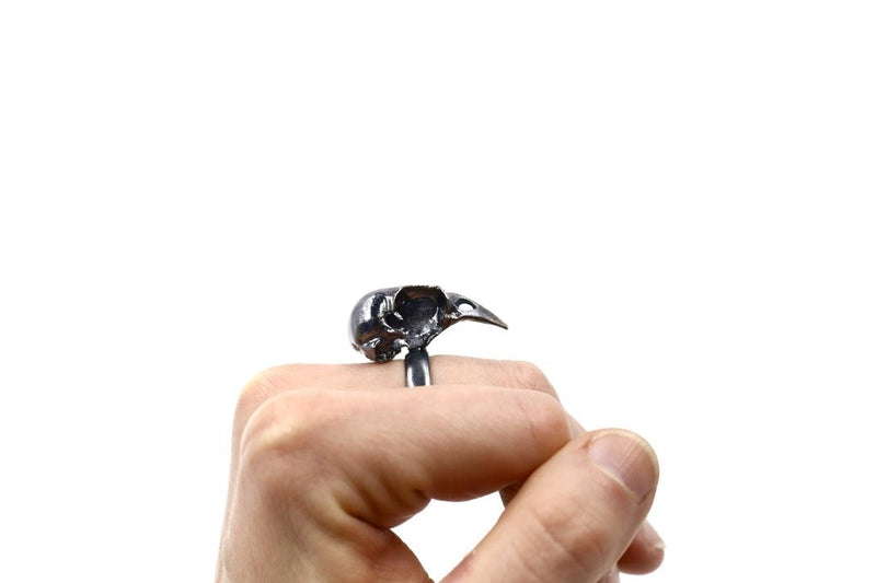 Side View of oxidized Silver Bird Skull Ring on Hand 