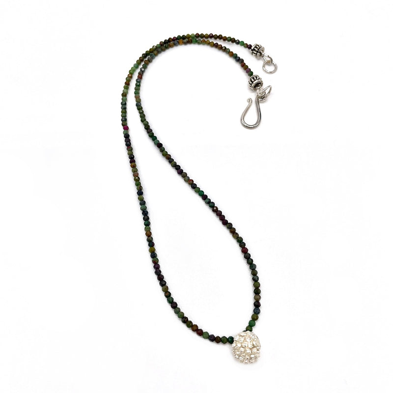 sterling silver kousa dogwood pendant necklace on dark green and brown beads
