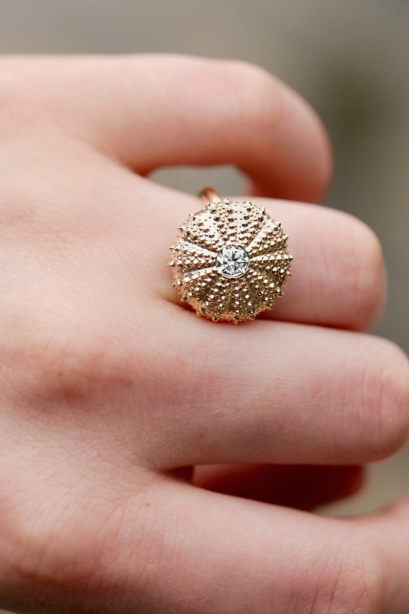 14k gold sea urchin ring with white diamond on model hand