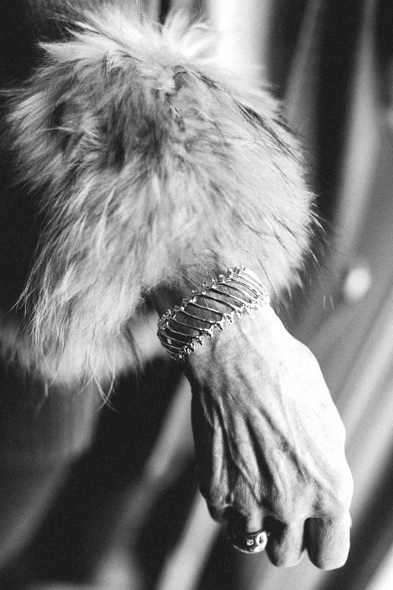 rattlesnake rib multi cuff on model wearing fur cuffed coat