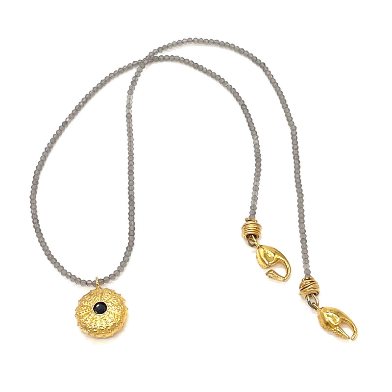 gold vermeil sea urchin pendant with black onyx on grey beads