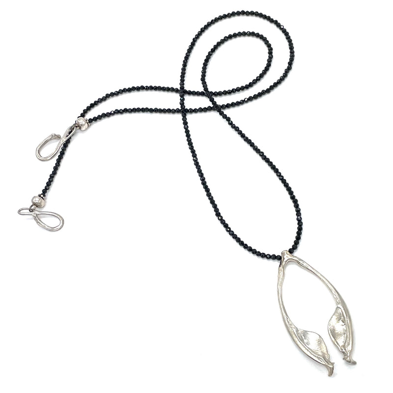 sterling silver rattlesnake jawbone pendant on opera length black beads