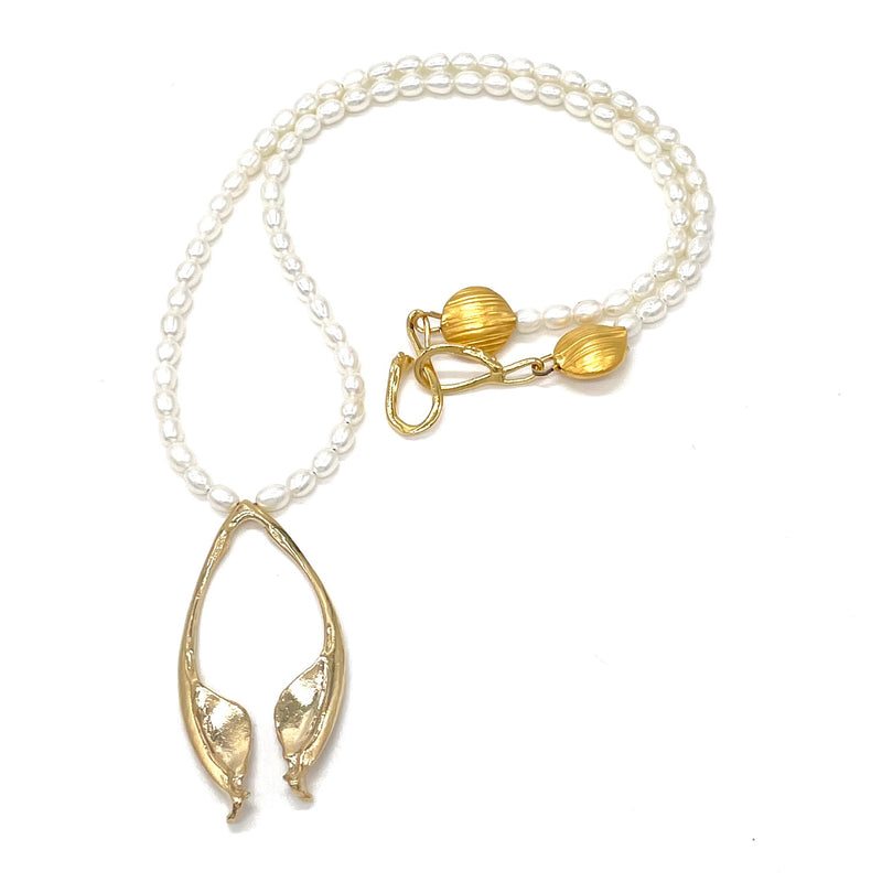 gold vermeil rattlesnake jawbone pendant on pearl strand