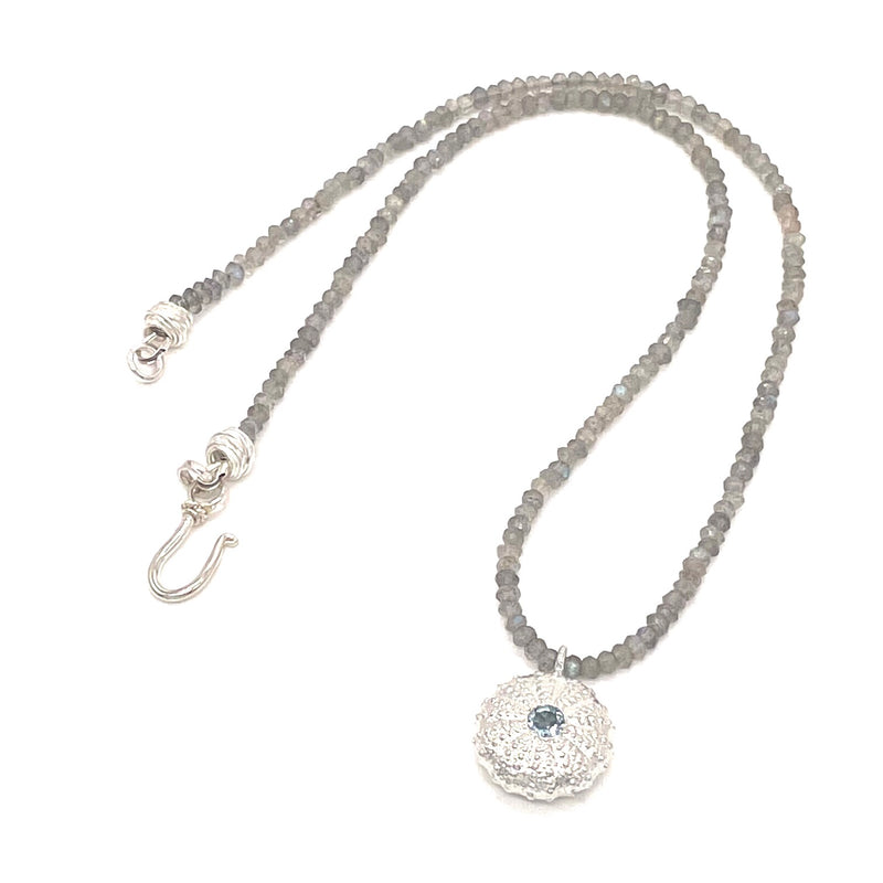 sterling silver sea urchin pendant with sky blue topaz on smokey quartz beads