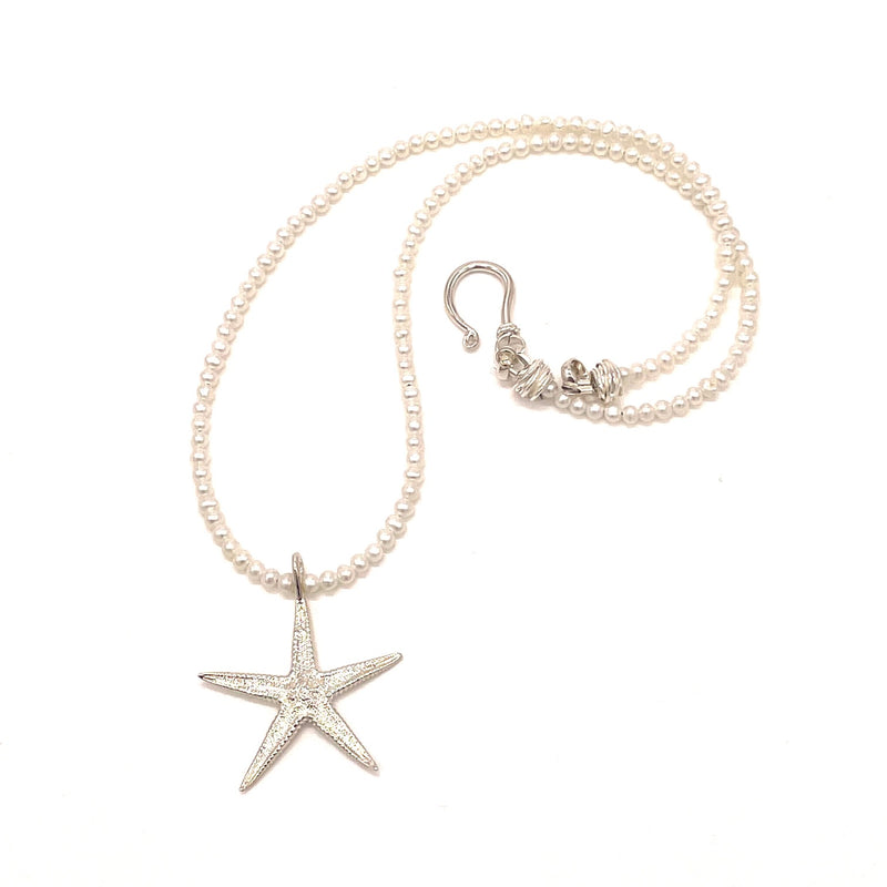 small starfish pendant necklace sterling silver on bearl strand gogo jewelry