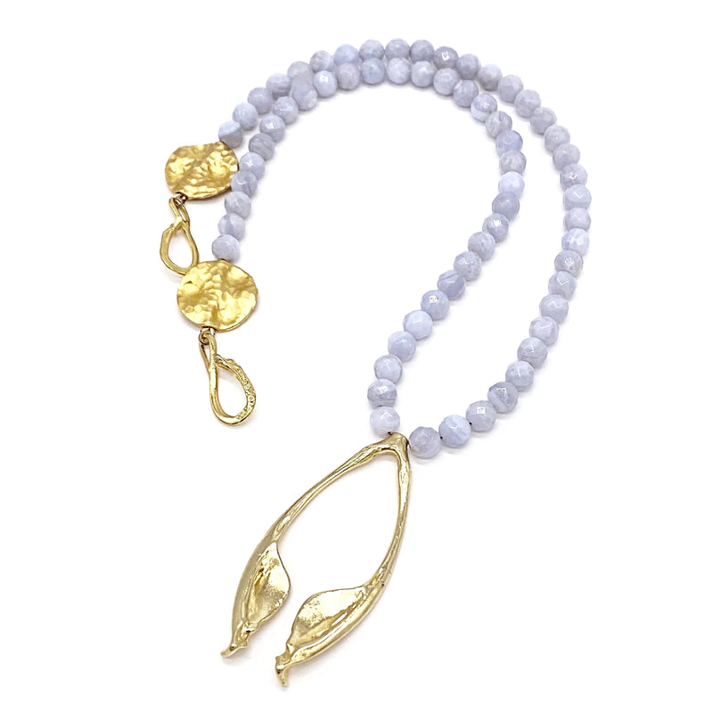 gold vermeil rattlesnake jawbone pendant on lavender beads