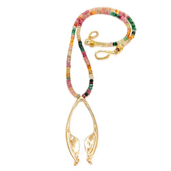 14k gold rattlesnake jawbone pendant on multi colored beads