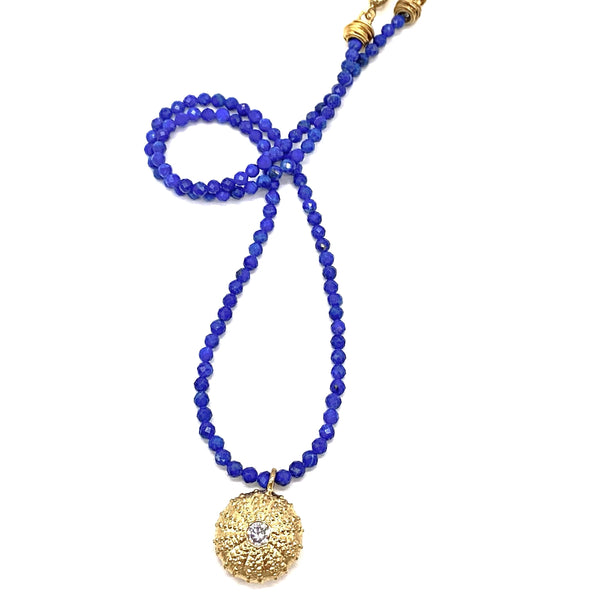 gold vermeil sea urchin pendant with cz on dark blue facted beads
