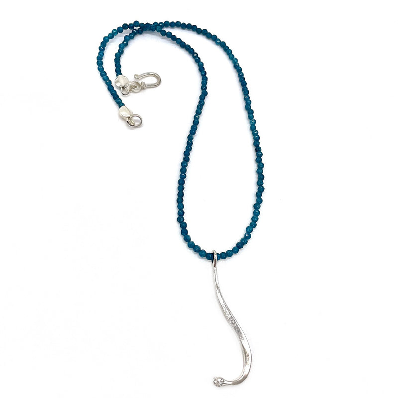 sterling silver raccoon pecker pendant on blue beads