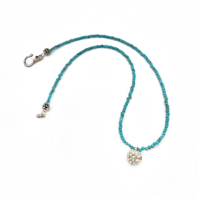 sterling silver kousa dogwood pendant necklace on turquoise beads