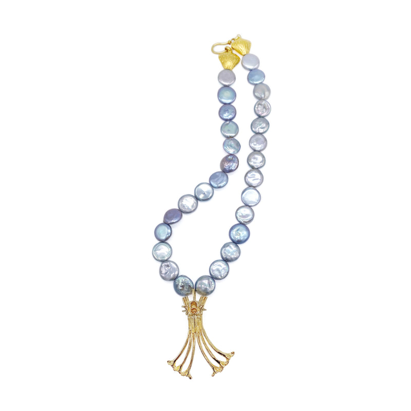 14k gold vermeil Gogo logo pendant on grey coin pearl beaded necklace on white background