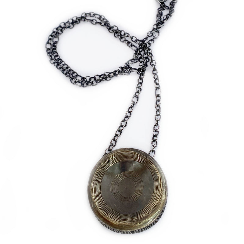 shark vertebrae pendant necklace alpaca oxidized close up on 35" sterling silver chain 