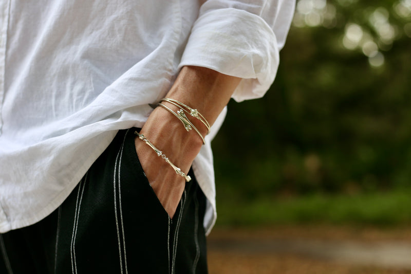 raccoon pecker cuff rattlesnake rib cuff on male model