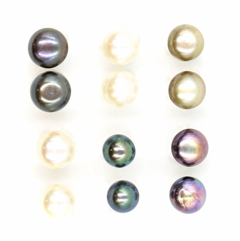 multi colored pearl stud earrings top view on white background
