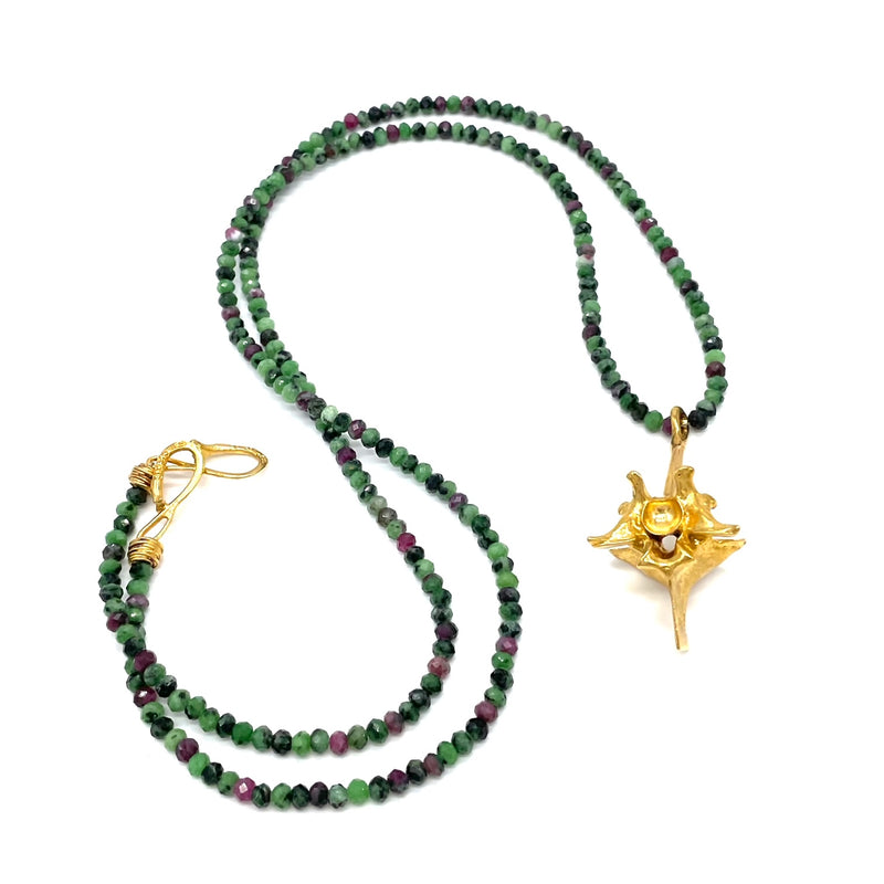 gold vermeil rattlesnake vertebrae extra large pendant on opera length multicolor beads