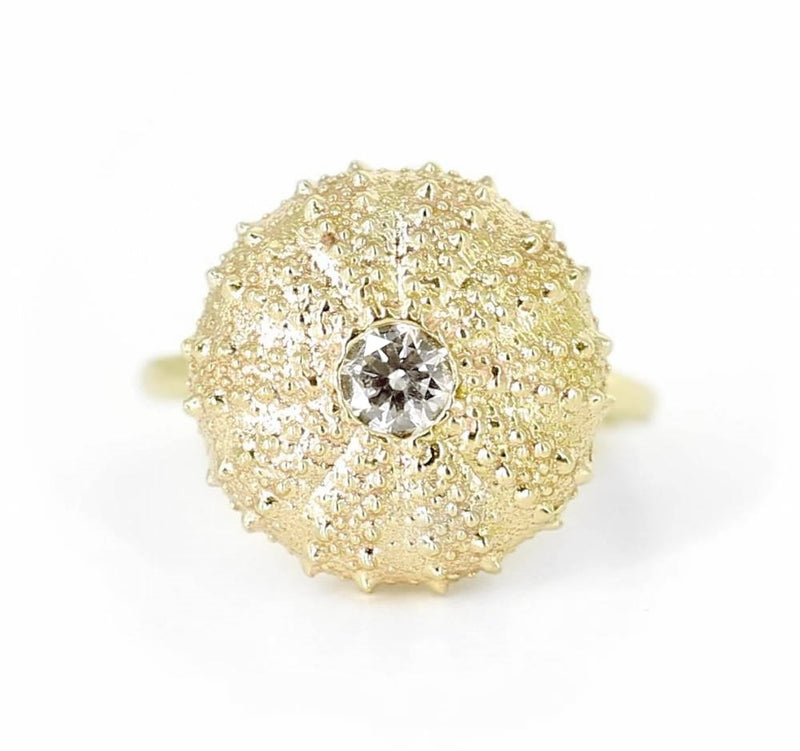sea urchin 14k gold ring with white diamond on white background