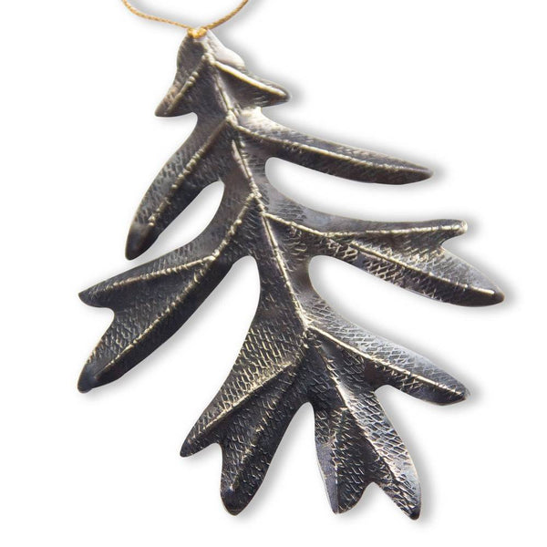 alpaca oxidized oak leaf ornament on white background