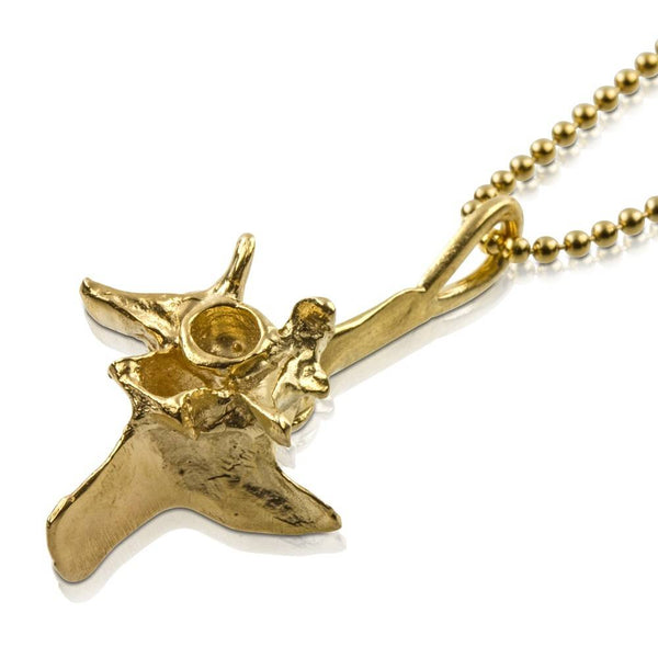 14k gold rattlesnake vertebrae pendant quarter view on gold bead chain 