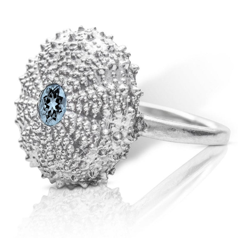 sterling silver sea urchin ring with sky blue topaz side view on white background