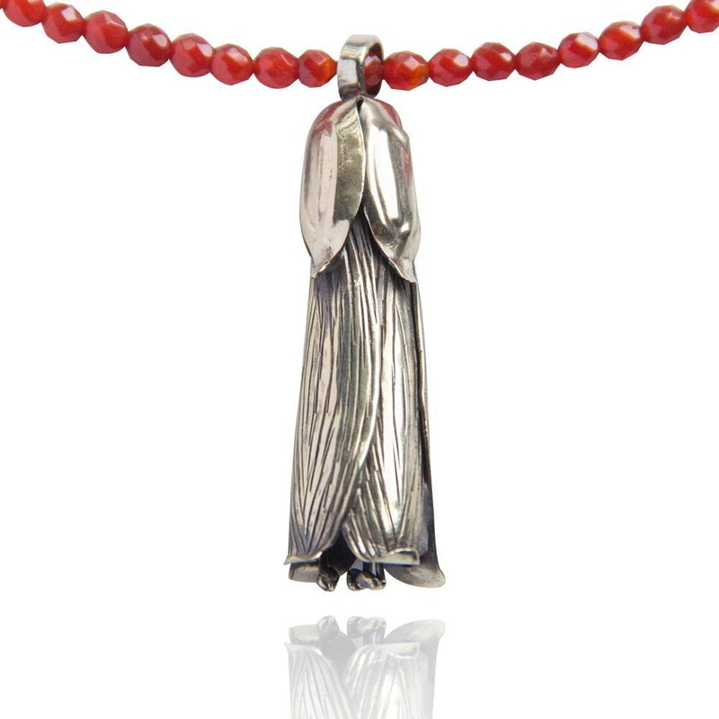 trumpet vine pendant necklace alpaca on red beads close up gogo jewelry